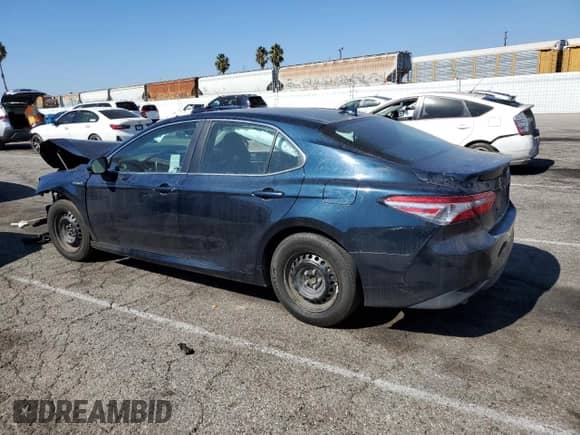 2019 Toyota Camry Hybrid LE с VIN 4T1B31HK2KU517027, выставлен на аукционе Copart как лот 85885055 с пробегом 84 432 миль миль и Списание • Salvage title. История ставок и продаж доступна на DreamBid. Изображение 2.