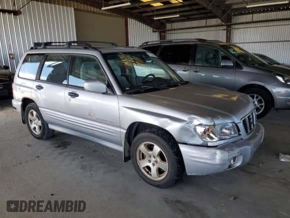 2002 Subaru Forester S with VIN JF1SF65602H712543, listed as a Copart auction lot 67325015 with 214,238 mi miles and Salvage title. Bid and sale history available at DreamBid. Image 4.