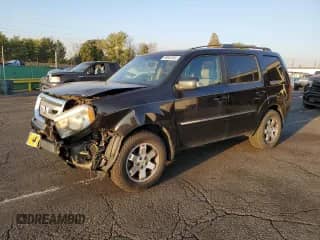 2010 Honda Pilot Touring with VIN 5FNYF4H87AB038749, listed as a Copart auction lot 69882305 with 141,496 mi miles and Salvage title. Bid and sale history available at DreamBid. Image 1.