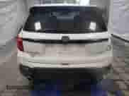 2024 Honda Passport EX-L with VIN 5FNYF8H54RB020153, listed as a Copart auction lot 52648075 with 13,958 mi miles and Salvage title. Bid and sale history available at DreamBid. Image 6.