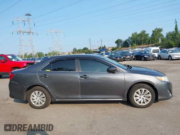 2013 Toyota Camry LE z VIN 4T1BD1FK5DU074343, wystawiony jako IAAI lot #42908273 z przebiegiem 180 827 mil mil oraz . Historia ofert i sprzedaży dostępna na DreamBid. Obrazek 13.