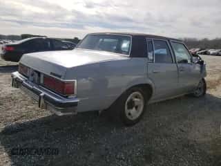 1982 Chevrolet Malibu Classic с VIN 1G1AW69J4CR214063, выставлен на аукционе Copart как лот 45906495 с пробегом Не указан миль и Списание • Salvage title. История ставок и продаж доступна на DreamBid. Изображение 3.