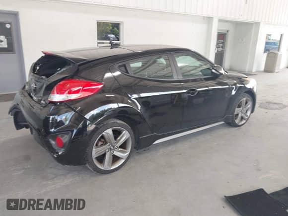 2013 Hyundai Veloster Turbo с VIN KMHTC6AEXDU167848, выставлен на аукционе IAAI как лот 43353403 с пробегом 84 077 миль миль и . История ставок и продаж доступна на DreamBid. Изображение 4.