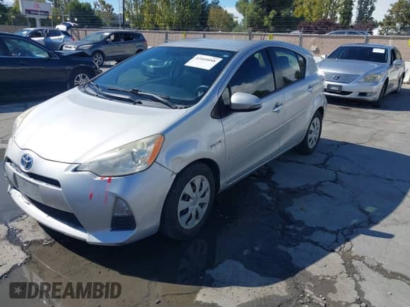2013 Toyota Prius One with VIN JTDKDTB39D1050210, listed as a IAAI auction lot 43460088 with 282,557 mi miles and . Bid and sale history available at DreamBid. Image 2.