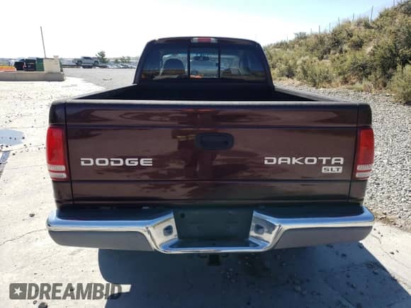 2004 Dodge Dakota SLT z VIN 1D7HG42N24S691756, wystawiony jako Copart lot #68787765 z przebiegiem 142 437 mil mil oraz Szkoda całkowita • Salvage title. Historia ofert i sprzedaży dostępna na DreamBid. Obrazek 6.