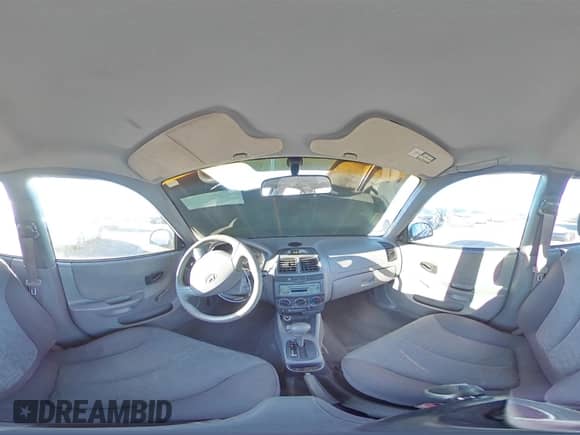 2005 Hyundai Accent GLS с VIN KMHCG45C95U665574, выставлен на аукционе Copart как лот 82603804 с пробегом 154 187 миль миль и Списание • Salvage title. История ставок и продаж доступна на DreamBid. Изображение 13.