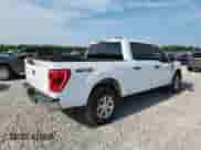 2023 Ford F-150 Lariat with VIN 1FTFW1E89PFA91516, listed as a Copart auction lot 61666315 with 65,711 mi miles and Salvage title. Bid and sale history available at DreamBid. Image 3.