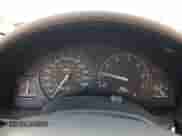 1999 Saturn SC with VIN 1G8ZR1275XZ375833, listed as a Copart auction lot 87960885 with 97,697 mi miles and Salvage title. Bid and sale history available at DreamBid. Image 9.