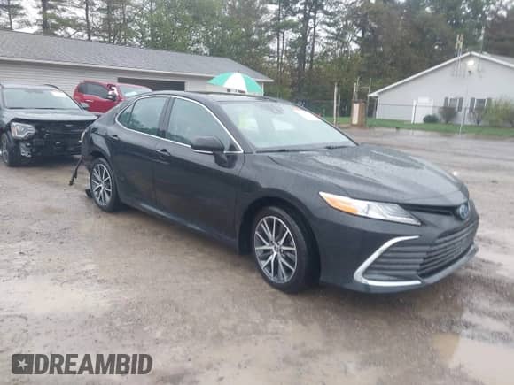 2023 Toyota Camry Hybrid XLE with VIN 4T1F31AK7PU602464, listed as a IAAI auction lot 43392293 with 41,716 mi miles and . Bid and sale history available at DreamBid. Image 1.