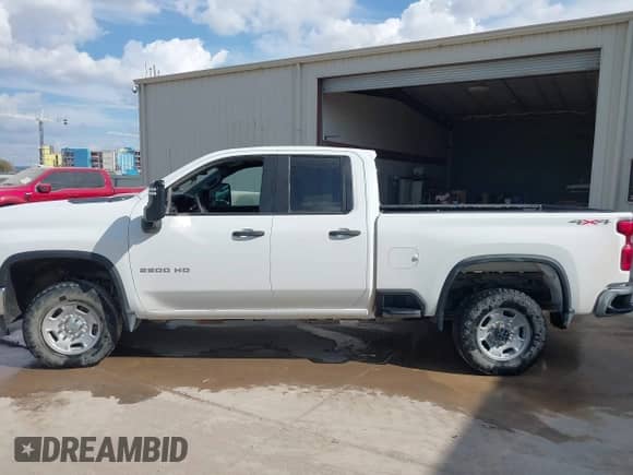 2023 Chevrolet Silverado 2500HD Work Truck with VIN 1GC2YLE7XPF210587, listed as a IAAI auction lot 43511140 with 74,915 mi miles and . Bid and sale history available at DreamBid. Image 14.