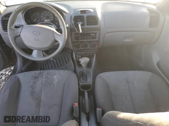 2005 Hyundai Accent GLS с VIN KMHCG45C95U592609, выставлен на аукционе Copart как лот 79048224 с пробегом 138 738 миль миль и Списание • Salvage title. История ставок и продаж доступна на DreamBid. Изображение 8.