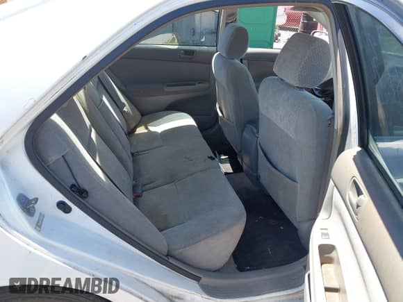 2002 Toyota Camry XLE z VIN JTDBF32K320019569, wystawiony jako IAAI lot #43175177 z przebiegiem 211 108 mil mil oraz . Historia ofert i sprzedaży dostępna na DreamBid. Obrazek 8.