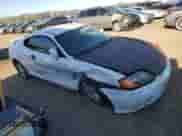 2004 Hyundai Tiburon GS with VIN KMHHM65DX4U153243, listed as a Copart auction lot 87869805 with 177,398 mi miles and Salvage title. Bid and sale history available at DreamBid. Image 4.