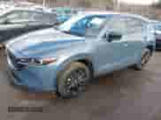 2022 Mazda CX-5 S Carbon Edition z VIN JM3KFBCM7N0579780, wystawiony jako IAAI lot #41460860 z przebiegiem 43 479 mil mil oraz . Historia ofert i sprzedaży dostępna na DreamBid. Obrazek 2.