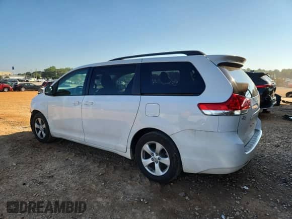 2012 Toyota Sienna LE with VIN 5TDKK3DC3CS180181, listed as a Copart auction lot 84601985 with 95,657 mi miles and Salvage title. Bid and sale history available at DreamBid. Image 2.