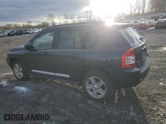 2010 Jeep Compass Latitude с VIN 1J4NF1FB0AD675869, выставлен на аукционе Copart как лот 83742284 с пробегом 167 564 миль миль и Списание • Salvage title. История ставок и продаж доступна на DreamBid. Изображение 2.