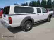 2003 Nissan Frontier XE with VIN 1N6ED29X13C419979, listed as a Copart auction lot 65806585 with 167,535 mi miles and Salvage title. Bid and sale history available at DreamBid. Image 3.