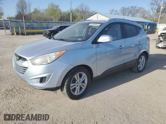 2011 Hyundai Tucson Limited with VIN KM8JU3AC7BU213263, listed as a Copart auction lot 52646455 with 165,236 mi miles and Salvage title. Bid and sale history available at DreamBid. Image 1.