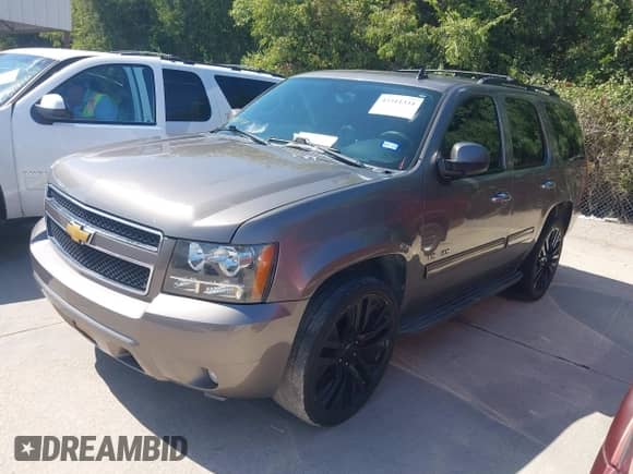 2012 Chevrolet Tahoe LT with VIN 1GNSCBE04CR161804, listed as a IAAI auction lot 43311334 with 242,513 mi miles and . Bid and sale history available at DreamBid. Image 2.