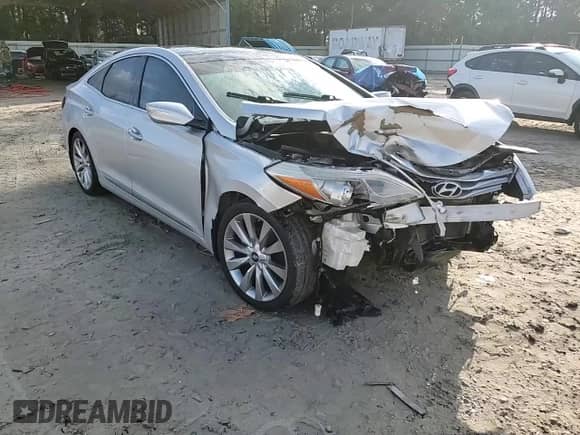 2013 Hyundai Azera с VIN KMHFH4JG6DA318058, выставлен на аукционе Copart как лот 79606684 с пробегом 107 104 миль миль и Списание • Salvage title. История ставок и продаж доступна на DreamBid. Изображение 14.