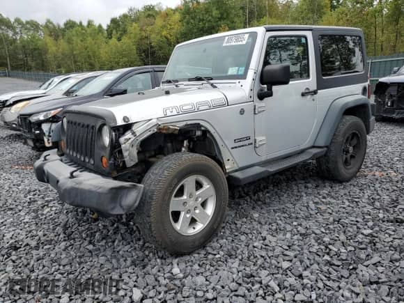 2012 Jeep Wrangler Sport z VIN 1C4AJWAG6CL228765, wystawiony jako Copart lot #80979855 z przebiegiem 216 434 mil mil oraz Szkoda całkowita • Salvage title. Historia ofert i sprzedaży dostępna na DreamBid. Obrazek 1.