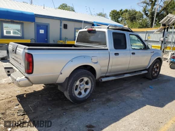 2004 Nissan Frontier SC with VIN 1N6MD29Y84C446845, listed as a Copart auction lot 73945614 with 126,183 mi miles and Salvage title. Bid and sale history available at DreamBid. Image 3.