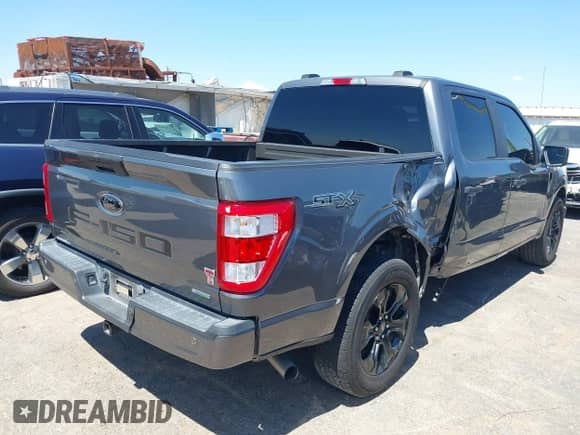 2022 Ford F-150 XL z VIN 1FTEW1CP1NFA79573, wystawiony jako IAAI lot #43100224 z przebiegiem 71 475 mil mil oraz . Historia ofert i sprzedaży dostępna na DreamBid. Obrazek 4.