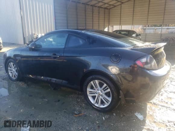 2008 Hyundai Tiburon GS with VIN KMHHM66D08U292138, listed as a Copart auction lot 83320704 with 277,189 mi miles and Salvage title. Bid and sale history available at DreamBid. Image 2.