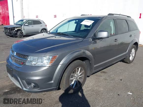 2013 Dodge Journey SXT with VIN 3C4PDCBB0DT583309, listed as a IAAI auction lot 43394726 with 128,326 mi miles and . Bid and sale history available at DreamBid. Image 2.