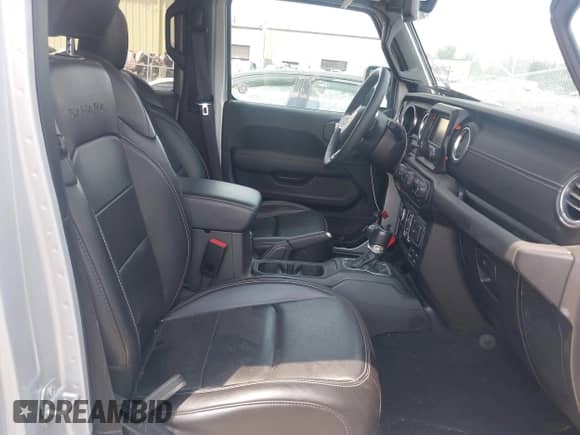 2023 Jeep Wrangler Sahara with VIN 1C4JJXP69PW695915, listed as a IAAI auction lot 42662028 with 36,957 mi miles and . Bid and sale history available at DreamBid. Image 5.