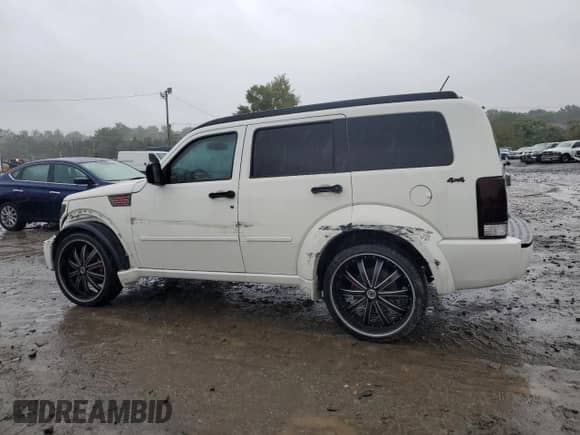 2010 Dodge Nitro SXT with VIN 1D4PU5GK1AW141099, listed as a Copart auction lot 71244454 with 144,628 mi miles and Salvage title. Bid and sale history available at DreamBid. Image 2.