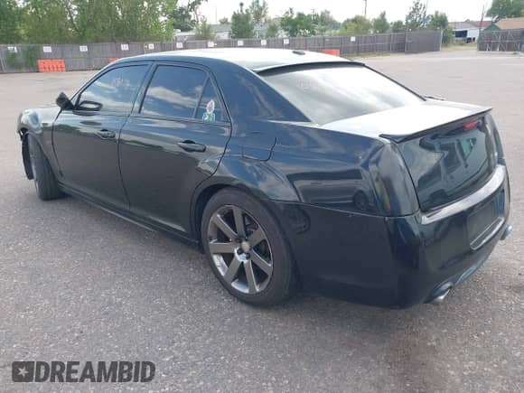 2014 Chrysler 300 SRT-8 with VIN 2C3CCAFJ9EH171489, listed as a IAAI auction lot 43108178 with 122,509 mi miles and . Bid and sale history available at DreamBid. Image 3.