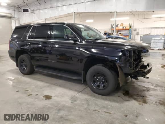 2020 Chevrolet Tahoe Commercial with VIN 1GNSKDEC5LR275805, listed as a Copart auction lot 82426155 with 139,590 mi miles and Salvage title. Bid and sale history available at DreamBid. Image 4.
