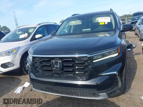 2023 Honda Pilot Touring с VIN 5FNYG2H77PB002996, выставлен на аукционе IAAI как лот 42070607 с пробегом 31 875 миль миль и . История ставок и продаж доступна на DreamBid. Изображение 13.