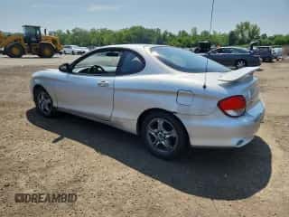 2001 Hyundai Tiburon с VIN KMHJG25FX1U237982, выставлен на аукционе Copart как лот 65774595 с пробегом 125 241 миль миль и Списание • Salvage title. История ставок и продаж доступна на DreamBid. Изображение 2.
