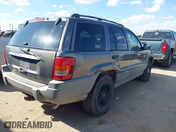 2002 Jeep Grand Cherokee Laredo with VIN 1J4GW48S22C109789, listed as a IAAI auction lot 43241658 with 229,235 mi miles and . Bid and sale history available at DreamBid. Image 4.