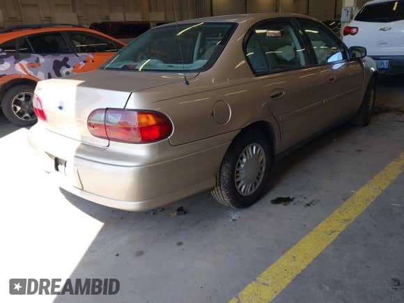 2004 Chevrolet Malibu Classic z VIN 1G1ND52F74M674064, wystawiony jako IAAI lot #42473384 z przebiegiem 127 001 mil mil oraz . Historia ofert i sprzedaży dostępna na DreamBid. Obrazek 4.