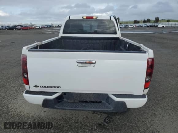 2012 Chevrolet Colorado Work Truck with VIN 1GCESBFE4C8129315, listed as a Copart auction lot 49639635 with 313,199 mi miles and Salvage title. Bid and sale history available at DreamBid. Image 6.