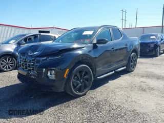 2023 Hyundai Santa Cruz Night Edition z VIN 5NTJCDAF2PH055327, wystawiony jako IAAI lot #43480482 z przebiegiem 12 493 mil mil oraz . Historia ofert i sprzedaży dostępna na DreamBid. Obrazek 2.