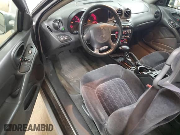 2001 Pontiac Grand Am GT z VIN 1G2NW12E81M525597, wystawiony jako Copart lot #55532685 z przebiegiem 144 167 mil mil oraz Szkoda całkowita • Salvage title. Historia ofert i sprzedaży dostępna na DreamBid. Obrazek 8.
