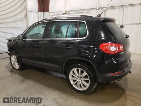 2011 Volkswagen Tiguan S с VIN WVGBV7AX9BW555801, выставлен на аукционе Copart как лот 82320045 с пробегом 169 337 миль миль и Списание • Salvage title. История ставок и продаж доступна на DreamBid. Изображение 2.