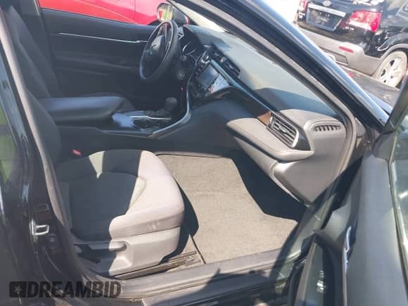 2020 Toyota Camry LE with VIN 4T1C11AKXLU877796, listed as a IAAI auction lot 43384594 with 78,546 mi miles and . Bid and sale history available at DreamBid. Image 5.