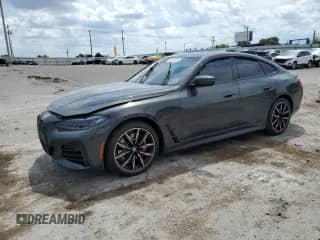 2022 BMW 4 Series 430i с VIN WBA63AV02NFM09568, выставлен на аукционе Copart как лот 68145555 с пробегом Не указан миль и Списание • Salvage title. История ставок и продаж доступна на DreamBid. Изображение 1.