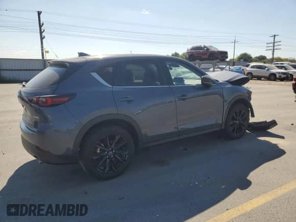 2024 Mazda CX-5 S Carbon Edition z VIN JM3KFBCM0R0369883, wystawiony jako Copart lot #67634595 z przebiegiem 25 085 mil mil oraz Szkoda całkowita • Salvage title. Historia ofert i sprzedaży dostępna na DreamBid. Obrazek 3.