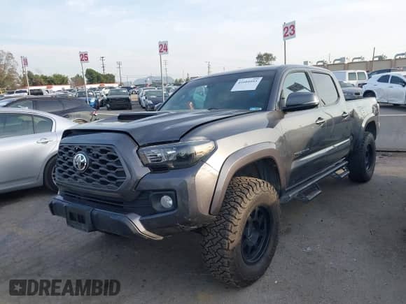2021 Toyota Tacoma SR5 z VIN 3TMDZ5BN2MM108586, wystawiony jako IAAI lot #41604953 z przebiegiem 65 422 mil mil oraz . Historia ofert i sprzedaży dostępna na DreamBid. Obrazek 17.