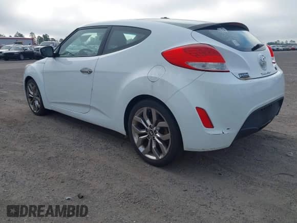 2014 Hyundai Veloster z VIN KMHTC6ADXEU213073, wystawiony jako IAAI lot #41551346 z przebiegiem 130 549 mil mil oraz . Historia ofert i sprzedaży dostępna na DreamBid. Obrazek 3.