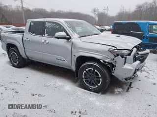 2024 Toyota Tacoma SR5 with VIN 3TMLB5JN6RM018639, listed as a IAAI auction lot 41251861 with 10,088 mi miles and . Bid and sale history available at DreamBid. Image 1.
