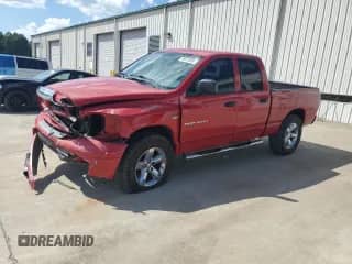 2006 Dodge 1500 SLT with VIN 1D7HU18236S675539, listed as a Copart auction lot 68913855 with 153,905 mi miles and Salvage title. Bid and sale history available at DreamBid. Image 1.