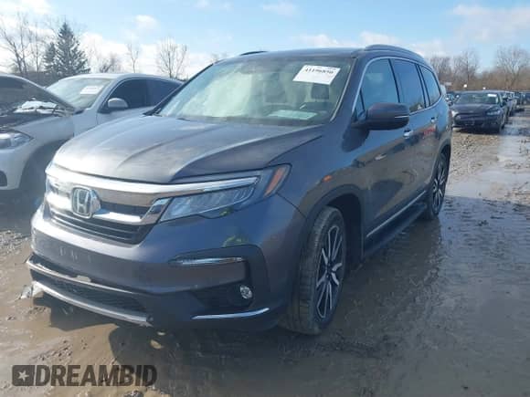 2022 Honda Pilot Elite z VIN 5FNYF6H0XNB014165, wystawiony jako IAAI lot #41196850 z przebiegiem 107 032 mil mil oraz . Historia ofert i sprzedaży dostępna na DreamBid. Obrazek 2.