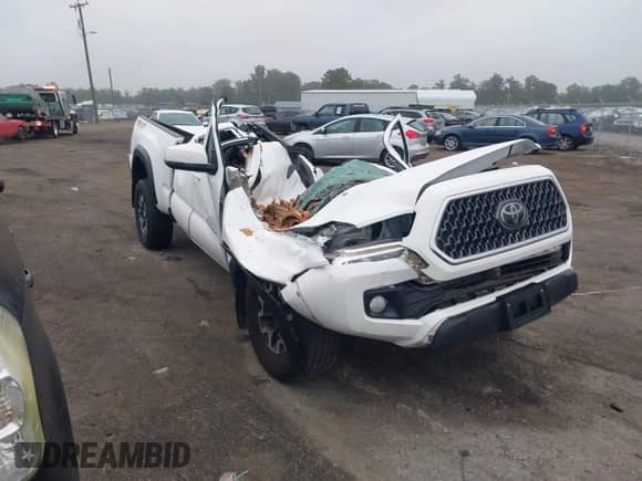 2018 Toyota Tacoma SR5 z VIN 5TFSZ5AN9JX161137, wystawiony jako IAAI lot #42857176 z przebiegiem Nie podano mil oraz . Historia ofert i sprzedaży dostępna na DreamBid. Obrazek 1.